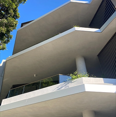 Close up of ECOTONE Minsil applied to the soffits and columns.